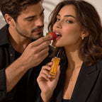 Rhama Strawberry Flirt 8ml perfume bottle shown in a lifestyle scene